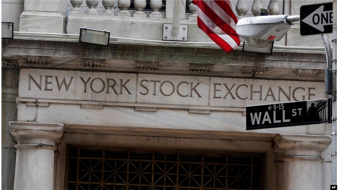 This 2014 file photo shows the Wall Street entrance of the New York Stock Exchange.