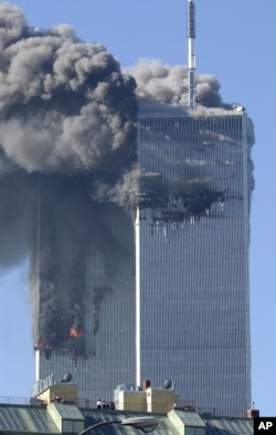 Smoke billows from the World Trade Center's Twin Towers before they collapsed on September 11, 2001, in New York City when today's millennials were too young to understand the event.