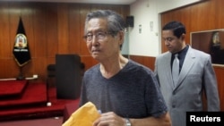 FILE - Peru's former President Alberto Fujimori arrives in court during the sentencing in his trial on charges of embezzling state funds to manipulate the media during his tenure as president, in Lima, Peru, Jan. 8, 2015. 