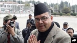 Communist Party of Nepal (Unified Marxist Leninist) Chairman Jhalanath Khanal arrives at parliament in Kathmandu, February 2, 2011