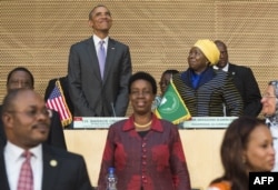 US President Barack Obama (L), alongside African Union Chairperson Nkosazana Dlamini Zuma (R), arrives to speak about security and economic issues and US-Africa relations in Africa at the African Union Headquarters in Addis Ababa, on July 28, 2015.