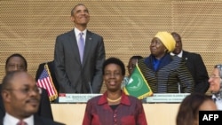 US President Barack Obama (L), alongside African Union Chairperson Nkosazana Dlamini Zuma (R), arrives to speak about security and economic issues and US-Africa relations in Africa at the African Union Headquarters in Addis Ababa, on July 28, 2015. 