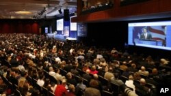 Attendees listen to Republican Ron Paul speak at the 38th annual Conservative Political Action Conference (CPAC) in Washington February 10, 2011.