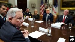 From back center clockwise; Homeland Security Secretary Kirstjen Nielsen, President Donald Trump, Immigration and Customs Enforcement Deputy Director Thomas Homan, Attorney General Jeff Sessions and Sen. Tom Cotton, R-Ark., listen to law enforcement officers speak during talks on sanctuary cities hosted by Trump in the Roosevelt Room of the White House, March 20, 2018.