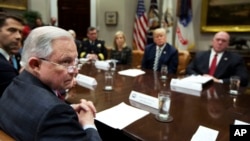 From back center clockwise; Homeland Security Secretary Kirstjen Nielsen, President Donald Trump, Immigration and Customs Enforcement Deputy Director Thomas Homan, Attorney General Jeff Sessions and Sen. Tom Cotton, R-Ark., listen to law enforcement officers speak during talks on sanctuary cities hosted by Trump in the Roosevelt Room of the White House, March 20, 2018.