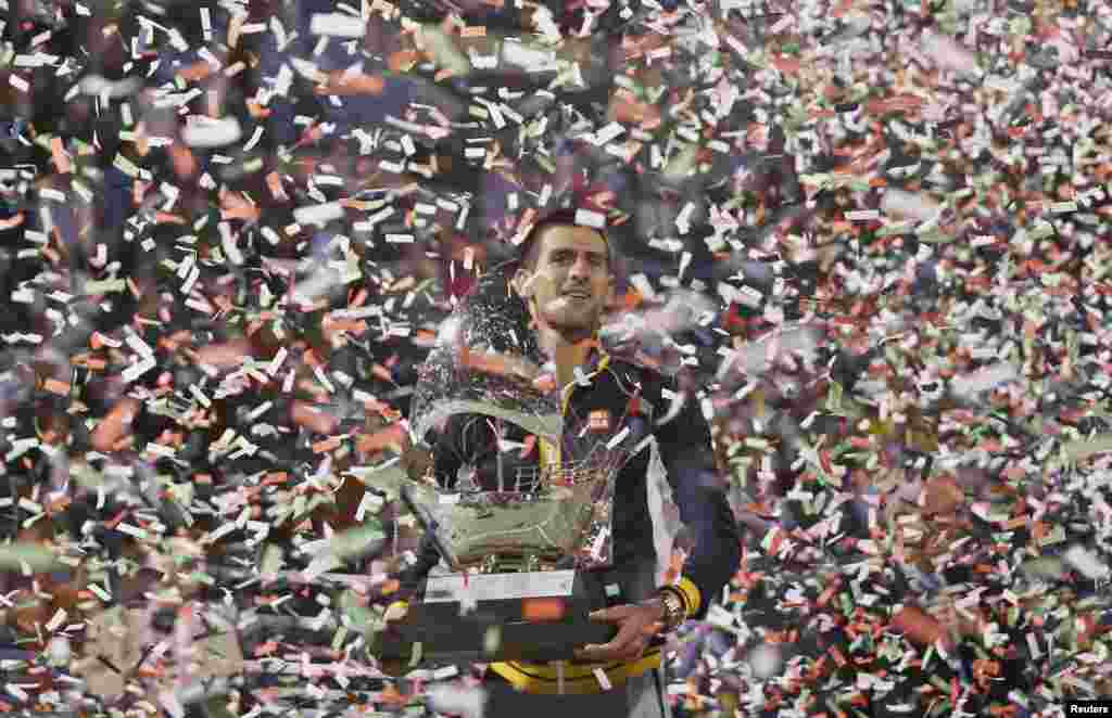 Novak Djokovic of Serbia poses with the trophy after winning the men&#39;s singles final match against Tomas Berdych of Czech Republic during the ATP Dubai Tennis Championships, United Arab Emirates.