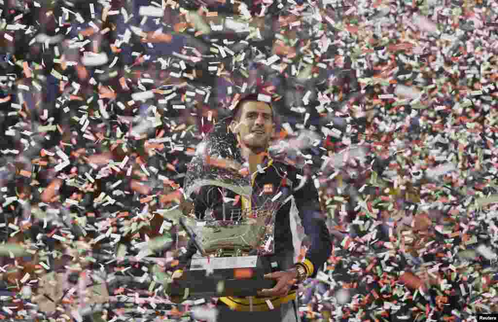 Novak Djokovic of Serbia poses with the trophy after winning the men's singles final match against Tomas Berdych of Czech Republic during the ATP Dubai Tennis Championships, United Arab Emirates.