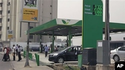 A gas station displays the price for fuel at a petrol station in Lagos, Nigeria, January 17, 2012.