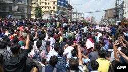 Bangladeshi students block a road during a protest in Dhaka on March 20, 2019, following the death of a student in a road accident on March 19.