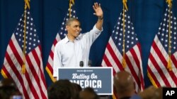 President Barack Obama waves at Dobbins Elementary School in Poland, Ohio during his Betting On America campaign tour, July 6, 2012.