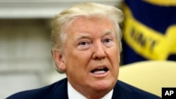 President Donald Trump talks to the media after new White House Chief of Staff John Kelly was privately sworn in during a ceremony in the Oval Office, July 31, 2017, in Washington. 