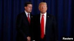 FILE - Then-White House staff secretary Rob Porter (L) is seen with U.S. President Donald Trump at Trump's golf estate in Bedminster, New Jersey, Aug.12, 2017.