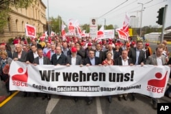 Coal miners and energy workers took to the streets of Berlin to protest a planned tax on emissions from lignite coal plants, April 25, 2015.