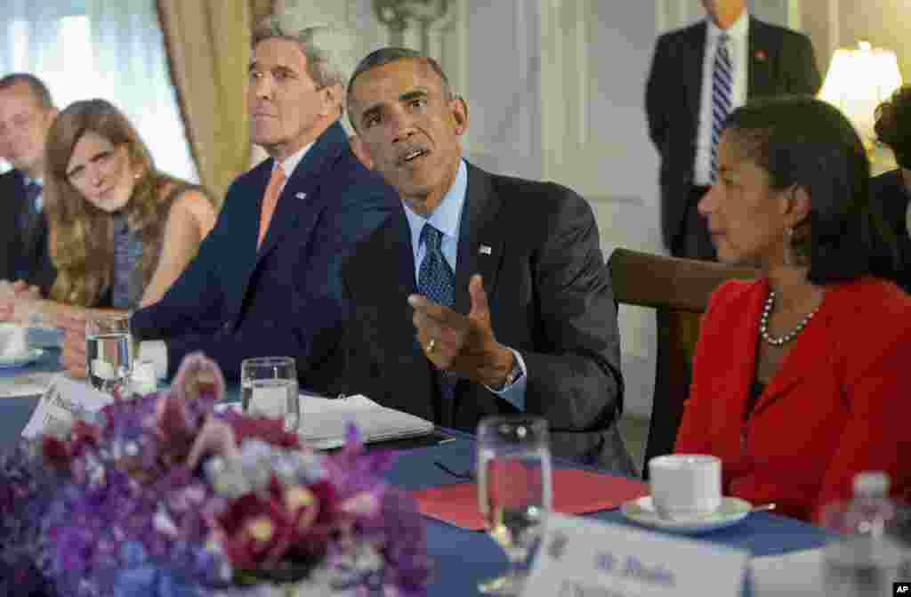 President Barack Obama, flanked by Secretary of State John Kerry and National Security Adviser Susan Rice, speaks during his meeting with the representatives of Bahrain, Qatar, Saudi Arabia, Jordan, United Arab Emirates and Iraq in New York, Tuesday, Sept. 23, 2014. 