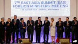 Foreign ministers applaud after a group photo at the 50th ASEAN Ministerial Meetings in Manila, Philippines, Aug. 7, 2017. From left, South Korea's Kang Kyung-wha, Thailand's Don Pramudwinai, Russia's Sergey Lavrov, Vietnam's Binh Minh, U.S.'s Rex Tillerson, Philippines' Allan Peter Cayetano, Singapore's Vivian Balakrishan, Australia's Julie Bishop, Brunei's Lim Jock Seng, China's Wang Yi and Cambodia's Prak Sokhonn. (AP Photo/Aaron Favila, Pool)