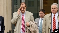 FILE - Former Massey Energy CEO Don Blankenship, left, makes his way out of the Robert C. Byrd U.S. Courthouse during a break in deliberations, Dec. 1, 2015, Charleston, West Virginia.