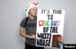 Tommy Craven, 24, poses for a portrait during the Resist March against President Donald Trump in West Hollywood, California, June 11, 2017.