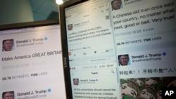 Computer screens display fake tweets that online users can self-generate at a Chinese website in Beijing, China, Jan. 26, 2017.