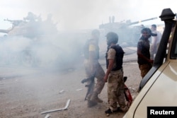 Libyan forces allied with the U.N.-backed government gather at the eastern frontline of fighting with Islamic State militants, in Sirte's neighborhood 650, Libya, Oct. 21, 2016.