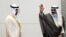 Kuwait's newly appointed Crown Prince Sheikh Meshal al-Ahmad al-Sabah waves before he is sworn in, as parliament Speaker Marzouq al-Ghanim stands next to him, in Kuwait City, Oct. 8, 2020. 