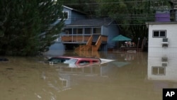 A truck is seen submerged in the flood waters of the Russian River in Forestville, north of San Francisco, Feb. 27, 2019. 
