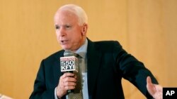 Sen. John McCain speaks during a forum with veterans in Phoenix, Arizona, May 9, 2014. 