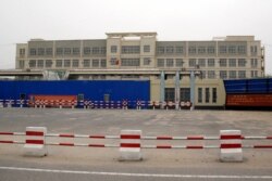 FILE - A building officially called a vocational skills education center is photographed in Hotan in Xinjiang Uighur Autonomous Region, China, Sept. 7, 2018.