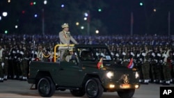 FILE - Senior Gen. Min Aung Hlaing, head of the military council, inspects officers during a parade to commemorate Myanmar's 79th Armed Forces Day, in Naypyitaw, Myanmar, March 27, 2024.