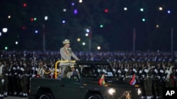 Senior Gen. Min Aung Hlaing, head of the military council, inspects officers during a parade to commemorate Myanmar's 79th Armed Forces Day, in Naypyitaw, Myanmar, March 27, 2024.