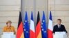 French President Emmanuel Macron and German Chancellor Angela Merkel attend a joint news conference at the Elysee Palace in Paris, France, Feb. 27, 2019. 