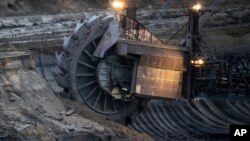 Mining machines . (Federico Gambarini/dpa via AP)