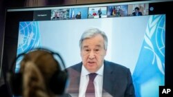 FILE - U.N. Secretary-General Antonio Guterres is seen speaking on a screen at the Environment Ministry, in Berlin, Germany, April 28, 2020. 