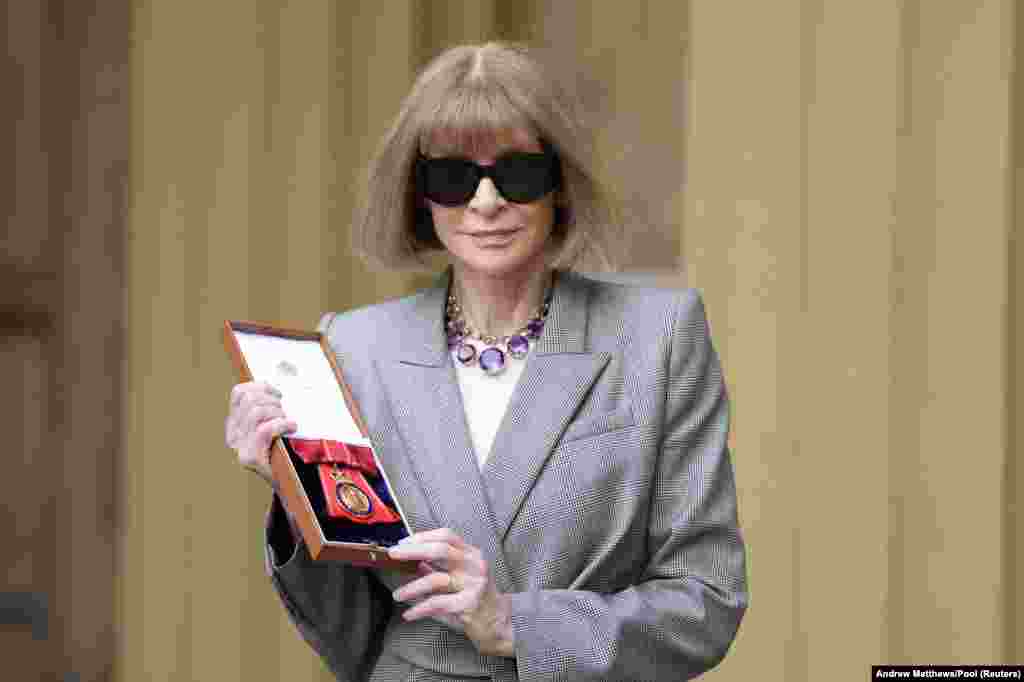 Dame Anna Wintour, Editor in Chief of Vogue, poses for a photo after being made a Companion of Honour at an Investiture ceremony at Buckingham Palace, central London.