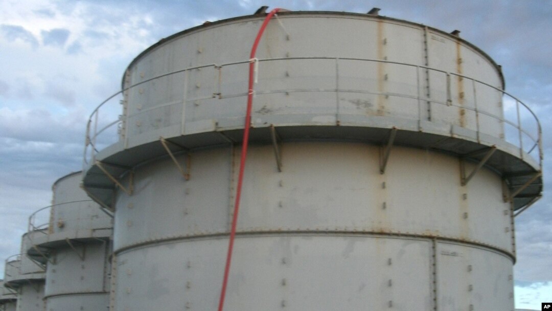 Tokyo Electric Power Co. shows the storage tank which workers detected the water dripping from the top, at the Fukushima Dai-ichi nuclear plant at Okuma town in Fukushima prefecture, northeastern Japan Thursday, Oct. 3, 2013. 