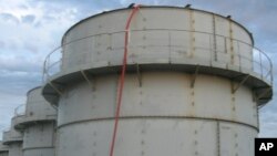 Tokyo Electric Power Co. shows the storage tank which workers detected the water dripping from the top, at the Fukushima Dai-ichi nuclear plant at Okuma town in Fukushima prefecture, northeastern Japan Thursday, Oct. 3, 2013. 