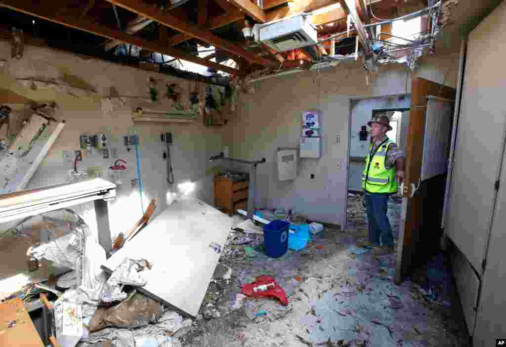 Joe Budds, a construction foreman for Otto Construction, inspects one of the rooms at the Feather River Hospital, Oct. 17, 2019, which was damaged during last year's Camp Fire in Paradise, Calif.