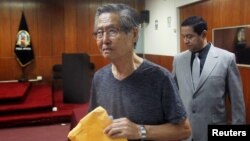 FILE - Peru's former President Alberto Fujimori arrives in court during the sentencing in his trial on charges of embezzling state funds to manipulate the media during his tenure as president, in Lima, Peru, Jan. 8, 2015. 