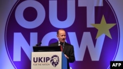 FILE - In this photo taken on Sept. 29, 2017, UK Independence Party's newly elected leader, Henry Bolton greets delegates on the first day of the UK Independence Party (UKIP) National Conference in Torquay, south-west England.