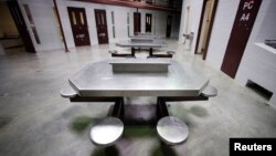 The interior of an unoccupied communal cellblock is seen at Camp VI, a prison used to house detainees at the U.S. Naval Base at Guantanamo Bay, March 5, 2013.