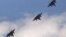 A trio of F-15 jets fly over Arlington, Virginia near the Pentagon, June 17, 2011 (file photo).