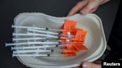 FILE - Syringes with AstraZeneca vaccine against the coronavirus disease (COVID-19) are pictured in Laakso hospital in Helsinki, Finland, March 11, 2021.