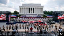 Two Bradley Fighting Vehicles flank the stage being prepared in front of the Lincoln Memorial, Wednesday, July 3, 2019, in Washington, ahead of planned Fourth of July festivities with President Donald Trump. 