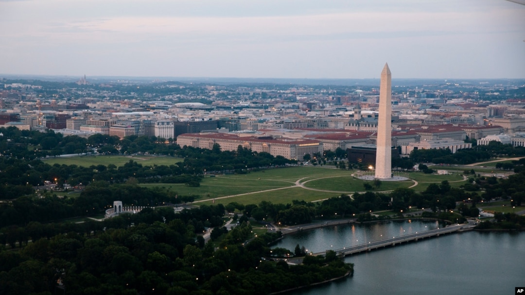 In this June 7, 2021, photo taken from the window of an American Airlines aircraft the Washington Monument is seen during a flight from Phoenix to Ronald Reagan Washington National Airport. 