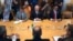 FILE - Libyan militia commander General Khalifa Haftar, top center, listens to Russian Foreign Minister Sergey Lavrov, bottom center, during their meeting in Moscow, Russia, Aug. 14, 2017.