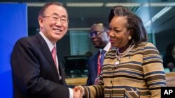 United Nations Secretary General Ban Ki-moon, left, greets Central African Republic President Catherine Samba-Panza as he arrives for a meeting on Central African Republic prior to the EU Africa summit at the EU Council building in Brussels, April 2, 2014