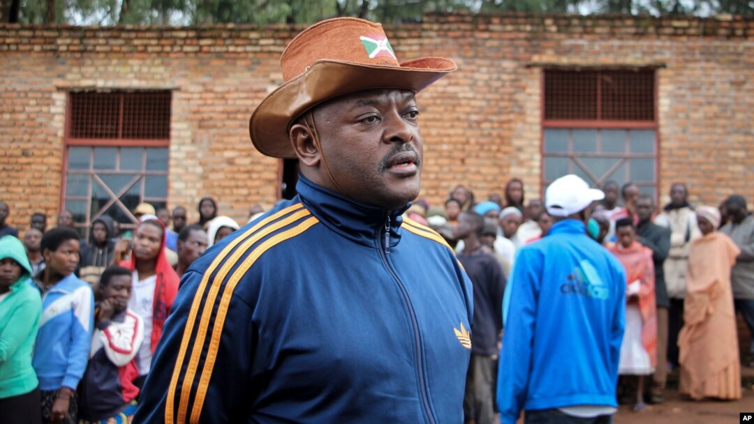 FILE - Burundi's President Pierre Nkurunziza speaks to the media after casting his vote in the constitutional referendum in Buye, north of Ngozi, in northern Burundi, May 17, 2018. 