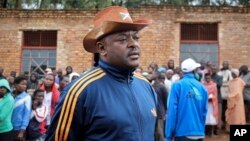 FILE - Burundi's President Pierre Nkurunziza speaks to the media after casting his vote in the constitutional referendum in Buye, north of Ngozi, in northern Burundi, May 17, 2018. 