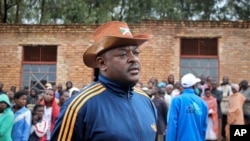 FILE - Burundi's President Pierre Nkurunziza speaks to the media after casting his vote in the constitutional referendum in Buye, north of Ngozi, in northern Burundi, May 17, 2018. 