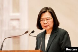 FILE PHOTO: Taiwan President Tsai Ing-wen speaks during a news conference with the incoming Taiwan Premier Chen Chien-jen and outgoing Taiwan Premier Su Tseng-chang, in Taipei