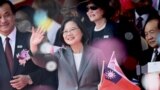 Taiwan President Tsai Ing-Wen waves during National Day celebrations in front of the Presidential Palace in Taipei on October 10, 2019. 